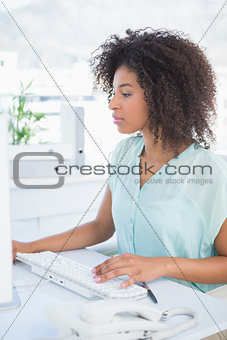 Casual businesswoman working at her desk