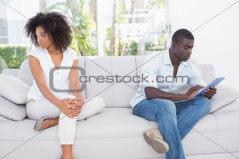 Attractive couple not talking on the couch