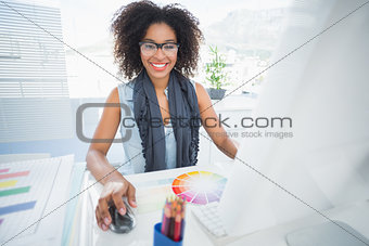 Pretty designer working at her desk