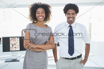 Young editorial team smiling at camera together