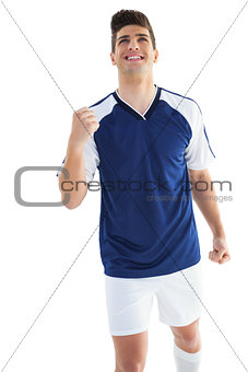 Football player in blue celebrating