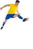Football player in yellow jumping