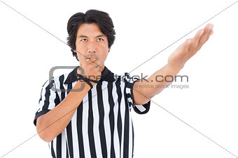 Stern referee blowing his whistle