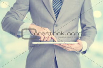 Businessman using tablet pc.