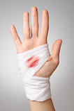 Hand with bloody bandage