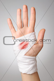 Hand with bloody bandage