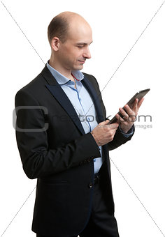 young male executive using digital tablet