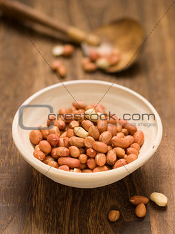 rustic raw uncooked peanuts