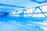 corridor structure with glass walls in blue