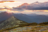 Panorama of Mountains -  sunset time. Beautiful peaks, clouds an
