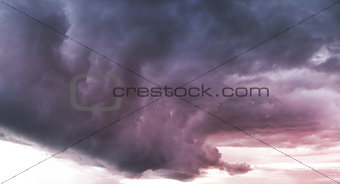 dark storm clouds before rain at sunset.
