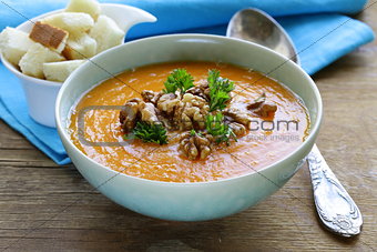 vegetable pumpkin cream soup with walnuts and parsley