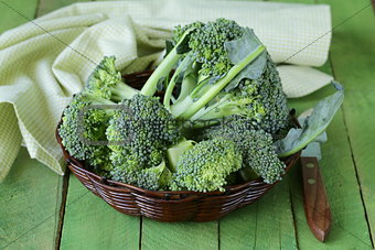 fresh organic broccoli in a wicker basket