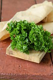 fresh green organic parsley on a wooden table