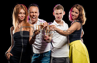 Cheerful group of young people with glasses of sparkling champagne