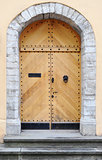 Ancient wooden door design in old city in Tallinn, Estonia