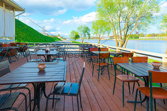 urban riverfront cafes and green trees