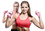 Two attractive athletic girl with dumbbells