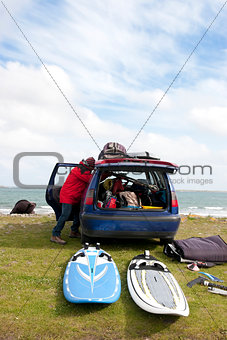 windsurfer getting ready from his car