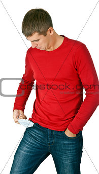 man looks with interest at his empty pocket