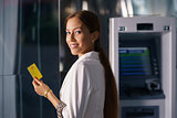 Portrait business woman withdraw cash machine card