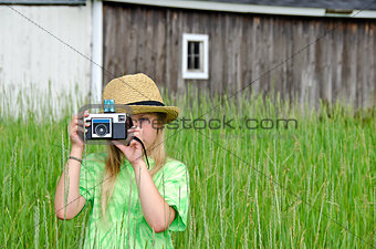 girl with old-fashioned camera