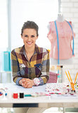 Portrait of happy dressmaker woman in studio