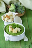 vegetable broccoli cream soup with white croutons and parsley