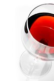 top of view of half red wine glass with space for text under daily light