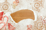 Christmas background with Candies, snowflakes  on wooden table