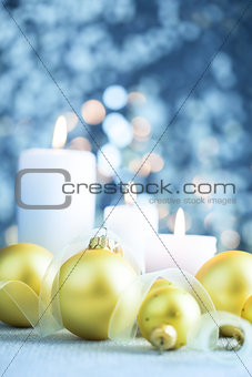 Christmas light blue background  with candles and baubles