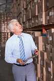 Warehouse manager checking his inventory