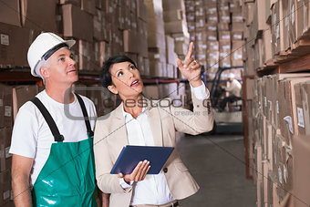 Warehouse worker and manager using tablet pc