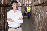 Pretty warehouse manager smiling at camera