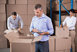 Warehouse workers packing up boxes