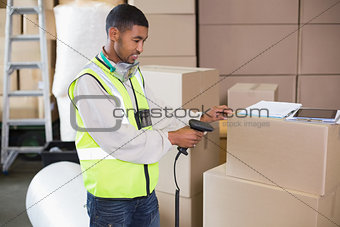 Warehouse worker scanning a box
