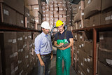 Warehouse manager talking with worker