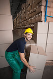 Warehouse worker loading up a pallet