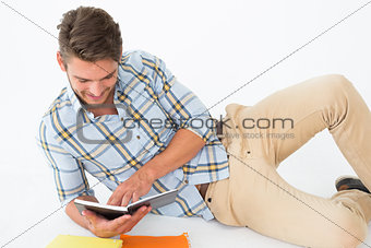 Relaxed young man reading book