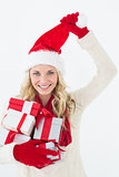 Attractive woman wearing santa hat with gifts