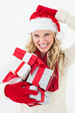 Santa woman scratching head and holding gifts