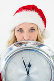 Attractive santa woman holding cropped clock