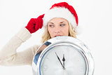 Attractive santa woman holding cropped clock