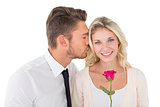 Young man kissing happy woman