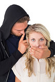 Theft covering young woman's mouth