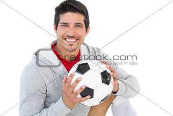 Portrait of a smiling handsome football fan