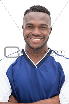 Portrait of a smiling handsome football player