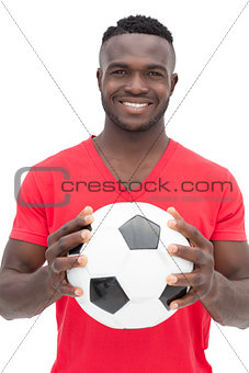 Portrait of a smiling handsome football fan