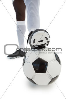 Football player standing with the ball