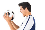 Side view of a football player shouting